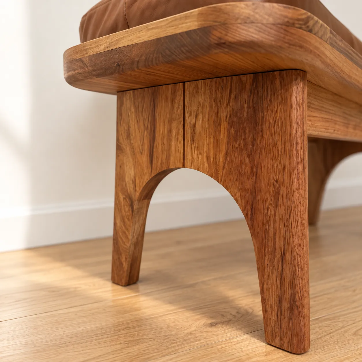 The arched end frame of the Keira Bench, up close